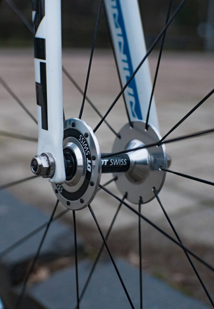 a close up of the spokes of a bicycle